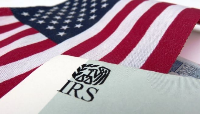 2021 Annual Report to Congress Released by IRS Taxpayer Advocate Office | IRS envelope on an American flag | Blue & Co., LLC Tax Advisors